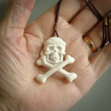 Hand carved natural bone pirate skull pendants online for sale. Creative pirate skull necklaces hand made from bone. Free shipping worldwide. We provide this pendant with an adjustable cord.