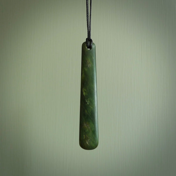 A hand carved large New Zealand Jade drop, roimata, necklace. The cord is a black colour and is a fixed length. A large sized hand made drop necklace by New Zealand artist Kerry Thompson. One off work of art to wear.