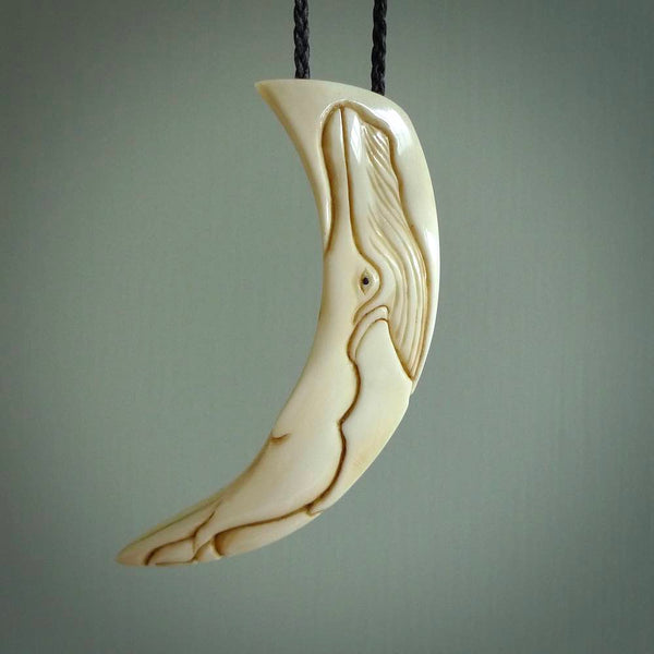 Hand carved incredible Boars Tusk whale  carving. A stunning work of art. This pendant was hand carved in pigs tusk with whale engraving by Fumio Noguchi. A one off collectors item that has been hand crafted to be worn or displayed.