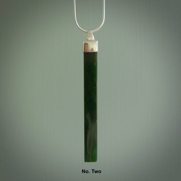 Hand carved New Zealand jade drop pendant with a sterling silver cap and chain.