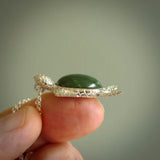 New Zealand Jade stone turtle in Sterling silver engraved casing. Hand carved jewellery made by NZ Pacific and for sale online. Moana, Ocean, jewellery hand carved in fire agate and Sterling Silver turtle necklace.