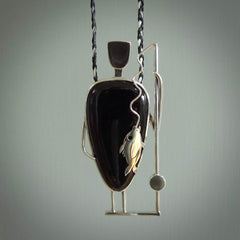 This is a very cool and creative fisherman hand made from Australian Black Jade and Sterling Silver. A fisherman who had caught a fish pendant hand crafted from sterling silver with Black Jade torso. A spectacular piece of art to wear.