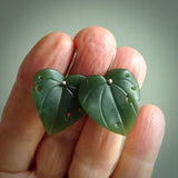 These are stunning heart shaped jade kawakawa leaf earrings carved in New Zealand by Josey Coyle. It is carved from a deep green piece of New Zealand Jade and with Sterling Silver hooks.