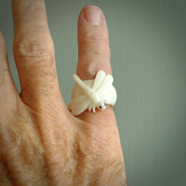 Hand carved natural bone dragonfly ring. Natural bone ring with dragonfly design. Hand made ring, delivered with international airmail. Postage is included. One only bone ring.