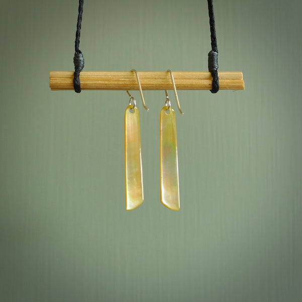 Hand carved New Zealand mother of pearl drop with arrowhead design earrings hand made by Kerry and Amanda Thompson. One only large drop earrings. Real New Zealand Mother of Pearl art to wear. Free Shipping worldwide.