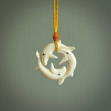 Hand carved natural bone whale trilogy pendant. Art to wear. Ocean themed pendants.