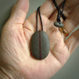 Argillite breastplate pendant with Jasper heart. Hand carved by Rhys Hall for NZ Pacific. Handmade jewellery for sale online. The cord is a 3-braid plait in black and has a loop and pebble toggle closure. Breastplate necklace for men and women. Heart breastplate necklace hand made from Argillite and Jasper.