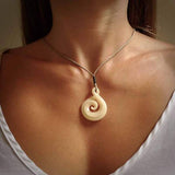 Hand carved bone twist with koru pendant. Real natural bone.