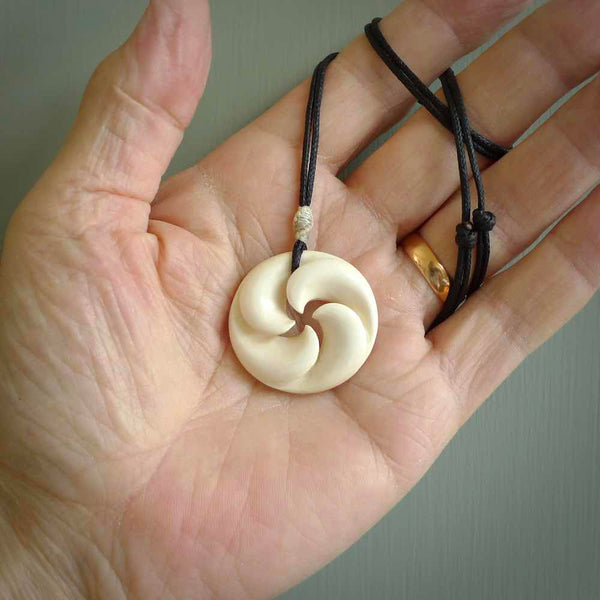 Hand carved koru style pendant. Made from Woolly Mammoth Tusk.