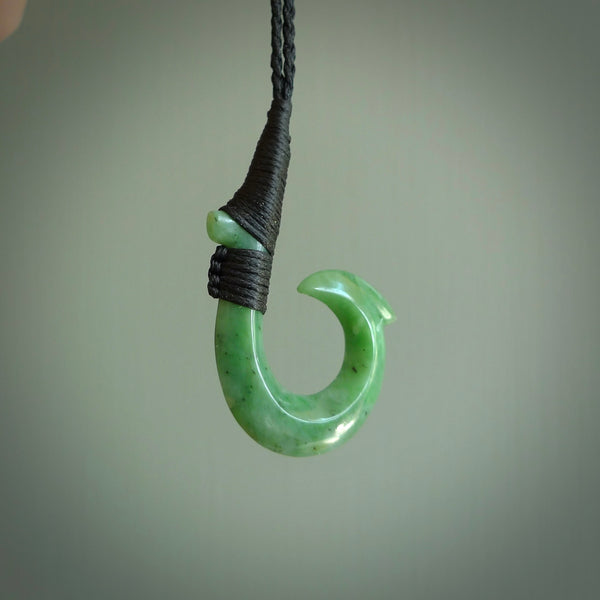These pendants are hand carved, green jade Hawaiian hooks or Makau pendants. They are beautifully finished in a high polish and bound with an adjustable cord. Hand made jewellery that make the most wonderful gifts. Free shipping worldwide.