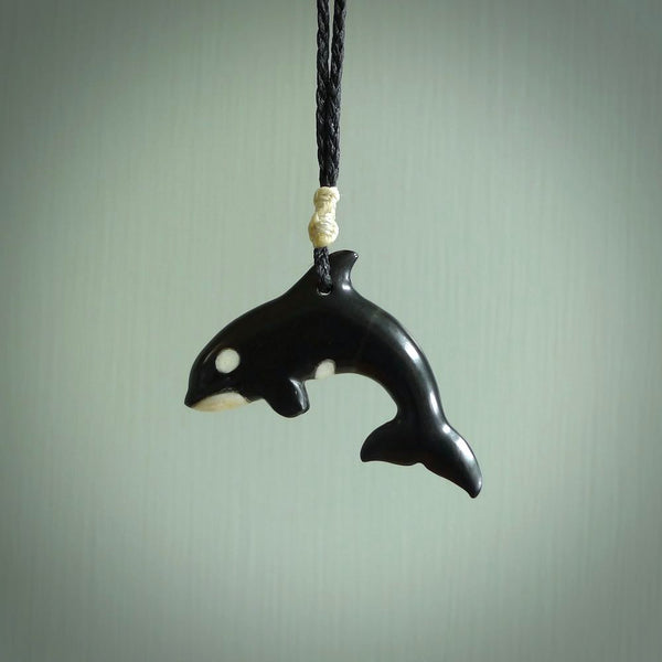 Hand carved black jade Orca pendant. Ocean themed pendants hand carved from natural materials by NZ Pacific. Unique handmade jewellery.