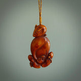 Hand carved stained bone meditating male figure pendant. Made from natural bone. Bone jewellery from the Pacific for sale online. Male pendant for men and women.