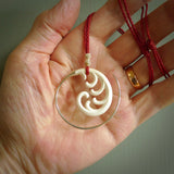 Hand carved pendants made from bone with sterling silver. NZ Pacific contemporary Koru pendants for sale online.