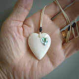 HAND CARVED HEART PENDANT. CARVED FROM BONE. PAUA HEART INSERT. HAND MADE BY NZ PACIFIC. HANDMADE JEWELLERY FOR SALE ONLINE.