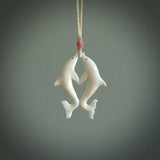 Hand carved natural double dolphin bone pendant. Hand made bone dolphin necklace, delivered with Express Courier. Hand crafted bone double dolphin pendant. One only necklace.