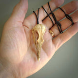 This is a hand carved deer antler huia bird skull pendant. It is made from deer antler, bone. This is a large sized necklace and is a very unique, one only, pendant that is a collectors piece. Hand carved deer antler huia skull necklace for men and women.