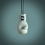 Hand carved boxing glove made from deer antler. The cord is adjustable so that you can wear this where it suits you best.