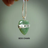 Hand crafted New Zealand jade love heart necklace. This piece has  a sterling silver love written across its' body. This necklace is provided with a sterling silver chain.