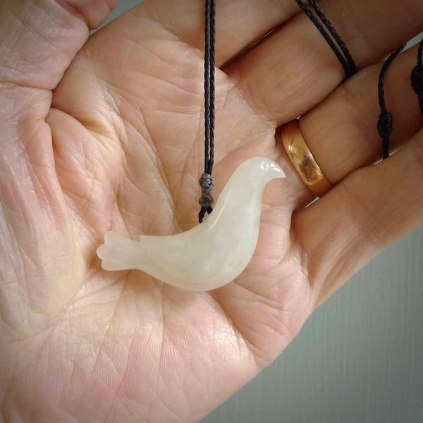 This pendant is a hand carved contemporary dove bird pendant. Carved in jadeite stone. It is a finely shaped piece with gentle and soft lines and is a great representation of the peace that doves traditionally represent. We ship these worldwide with DHL express courier. A fantastic and meaningful gift.