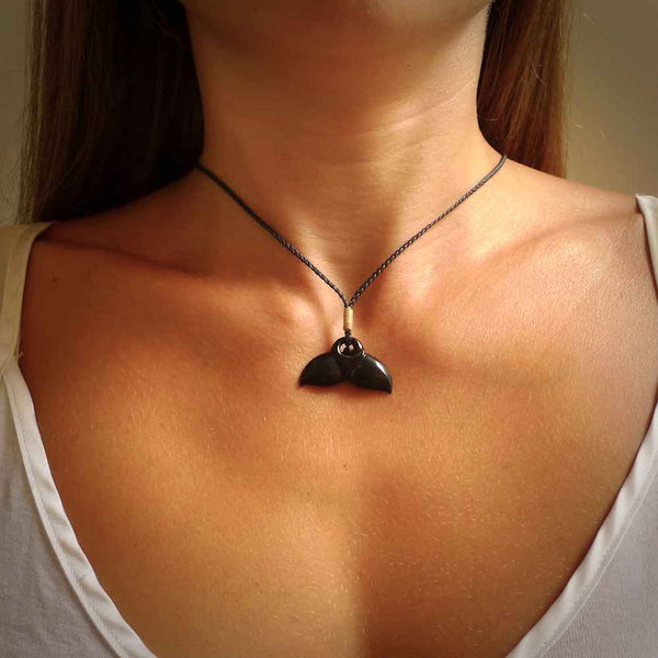 Hand carved black jade whaletail design. Whaletail koru pendant. Hand made jade jewellery for sale online.