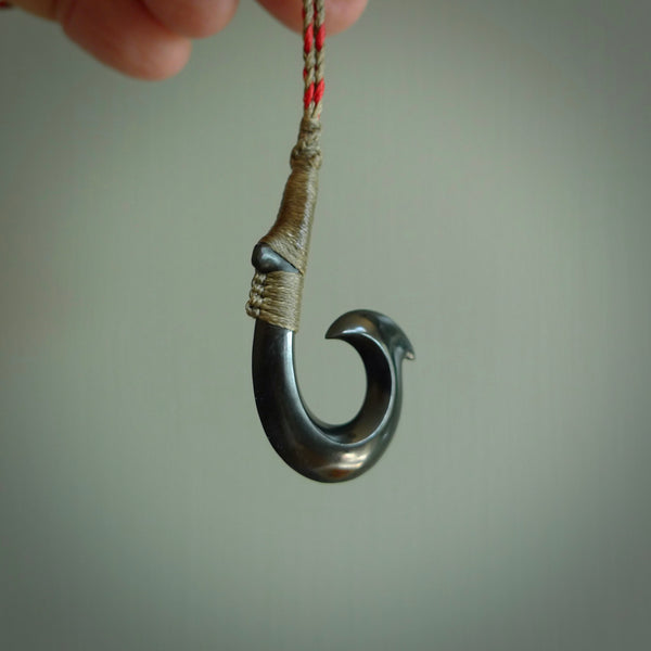 These pendants are hand carved, black jade Hawaiian hooks or Makau pendants. They are beautifully finished in a high polish and bound with a red khaki cord. Hand made jewellery that make the most wonderful gifts. Free shipping worldwide.