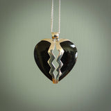 This is a handcarved love heart pendant made from a gorgeous and striking piece of Black Jade with sterling silver. This is a superbly carved and very unique piece if custom jewellery. For sale online from NZ Pacific.