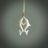 Hand carved natural double dolphin bone pendant. Hand made bone dolphin necklace, delivered with Express Courier. Hand crafted bone double dolphin pendant. One only necklace.