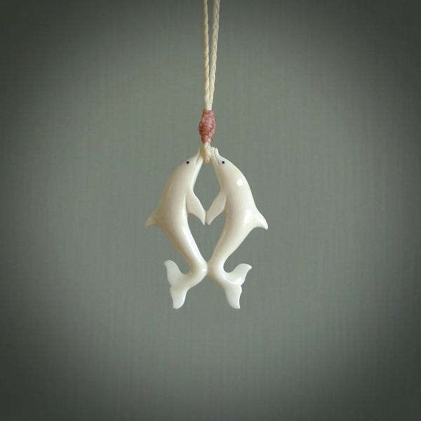 Hand carved natural double dolphin bone pendant. Hand made bone dolphin necklace, delivered with Express Courier. Hand crafted bone double dolphin pendant. One only necklace.