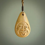 Hand carved incredible woolly mammoth tusk face carving. A stunning work of art. This pendant was hand carved in mammoth tusk by Yuri Terenyi. A one off collectors item that has been hand crafted to be worn or displayed. Shipping is included in the price. Delivered to you on an adjustable cord.