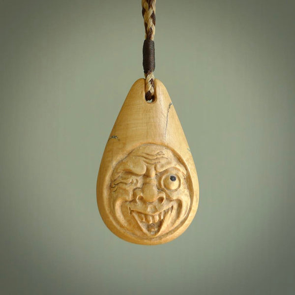 Hand carved incredible woolly mammoth tusk face carving. A stunning work of art. This pendant was hand carved in mammoth tusk by Yuri Terenyi. A one off collectors item that has been hand crafted to be worn or displayed. Shipping is included in the price. Delivered to you on an adjustable cord.