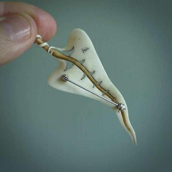 This is a large, hand carved leaf brooch. It is made from Bone and has a New Zealand Jade top. This is a large sized Lapel Pin and is a very unique, one only, brooch that is a collectors piece. Hand carved by New Zealand artist, Sami.
