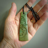 Hand made large New Zealand jade toki with koru pendant. Hand carved in New Zealand by Kerry Thompson. Hand made jewellery. Unique large Jade Toki with adjustable cord. Free shipping worldwide.
