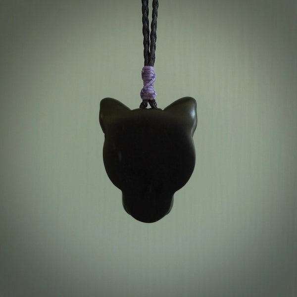 This pendant is a hand carved puma. We've carved this from a lovely piece of black jade and we provide it with a hand plaited cord. Shipping is free worldwide.