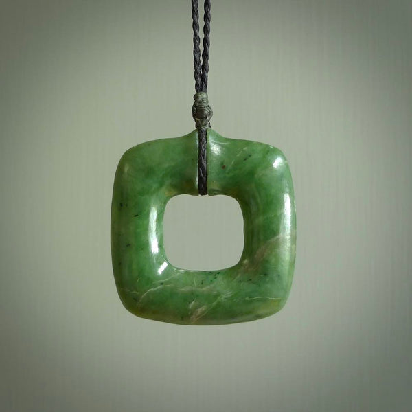 Hand carved jade pendant. Carved by NZ Pacific from New Zealand jade. This is a modern, contemporary pendant made from natural materials.
