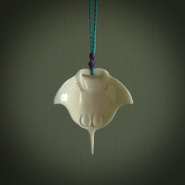 Hand carved bone manta ray pendant. Moana pendants carved by NZ Pacific. Hand made art to wear for sale online.