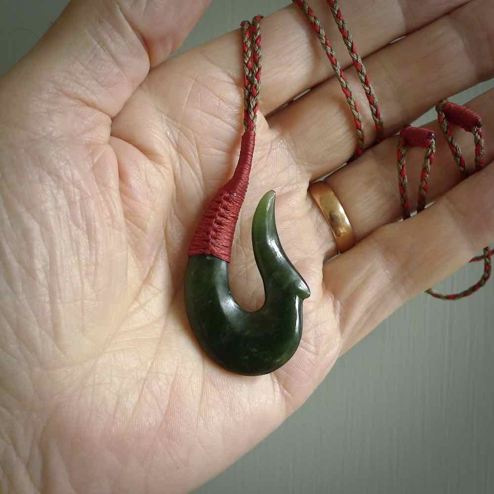 This photo shows a greenstone hook, or matau, pendant.