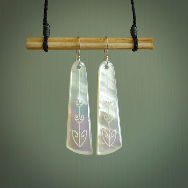 Hand carved New Zealand mother of pearl drop with koru design earrings hand made by Kerry and Amanda Thompson. One only large drop earrings. Real New Zealand Mother of Pearl art to wear. Free Shipping worldwide.