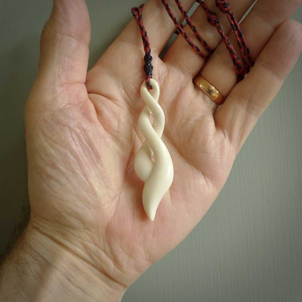 A handcarved masterpiece. A complex twist pendant carved from bone by Yuri Terenyi for NZ Pacific. This is a true piece of wearable art which is collectible. A one-off masterpiece and quite unique.