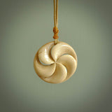 Hand carved koru style pendant. Made from Woolly Mammoth Tusk.