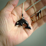 Hand carved black jade Orca pendant. Ocean themed pendants hand carved from natural materials by NZ Pacific. Unique handmade jewellery.