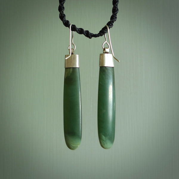 These are stunning Inanga jade drop earrings carved in New Zealand by Josey Coyle. They are carved from a light minty green piece of New Zealand Inanga Jade and with Sterling Silver caps, hooks and findings.