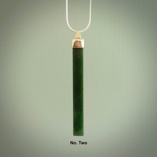 Hand carved New Zealand jade drop pendant with a sterling silver cap and chain.