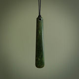 A hand carved large New Zealand Jade drop, roimata, necklace. The cord is a black colour and is a fixed length. A large sized hand made drop necklace by New Zealand artist Kerry Thompson. One off work of art to wear.