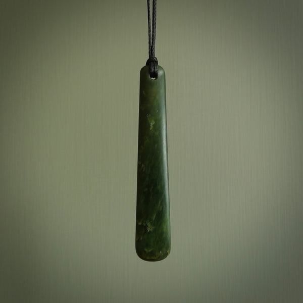 A hand carved large New Zealand Jade drop, roimata, necklace. The cord is a black colour and is a fixed length. A large sized hand made drop necklace by New Zealand artist Kerry Thompson. One off work of art to wear.