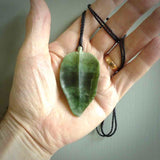 Hand carved New Zealand Jade leaf pendant with adjustable cord. This piece is a stand out work of creativity and skill and we love Raegan Bregmen's creations. Unique, one only, New Zealand made necklace for sale. Free shipping worldwide.