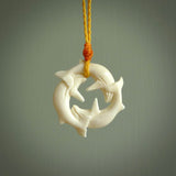 Hand carved natural bone whale trilogy pendant. Art to wear. Ocean themed pendants.