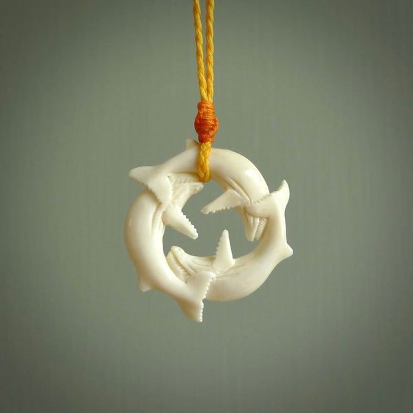 Hand carved natural bone whale trilogy pendant. Art to wear. Ocean themed pendants.