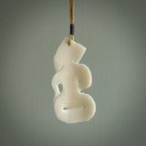 Hand carved tiki. Tiki Pendant made from cow bone by NZ Pacific. Ethnic handcarved jewellery for sale online.