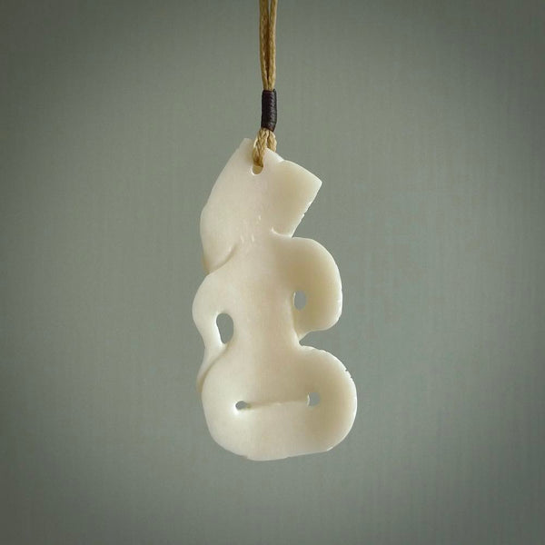 Hand carved tiki. Tiki Pendant made from cow bone by NZ Pacific. Ethnic handcarved jewellery for sale online.