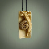 A hand carved bamboo with snail pendant carved from a piece of deer antler. This is a work of art carved by Fumio Noguchi who is renowned for his skill in bone carving. This is a great piece representing this very cool plant and animal.